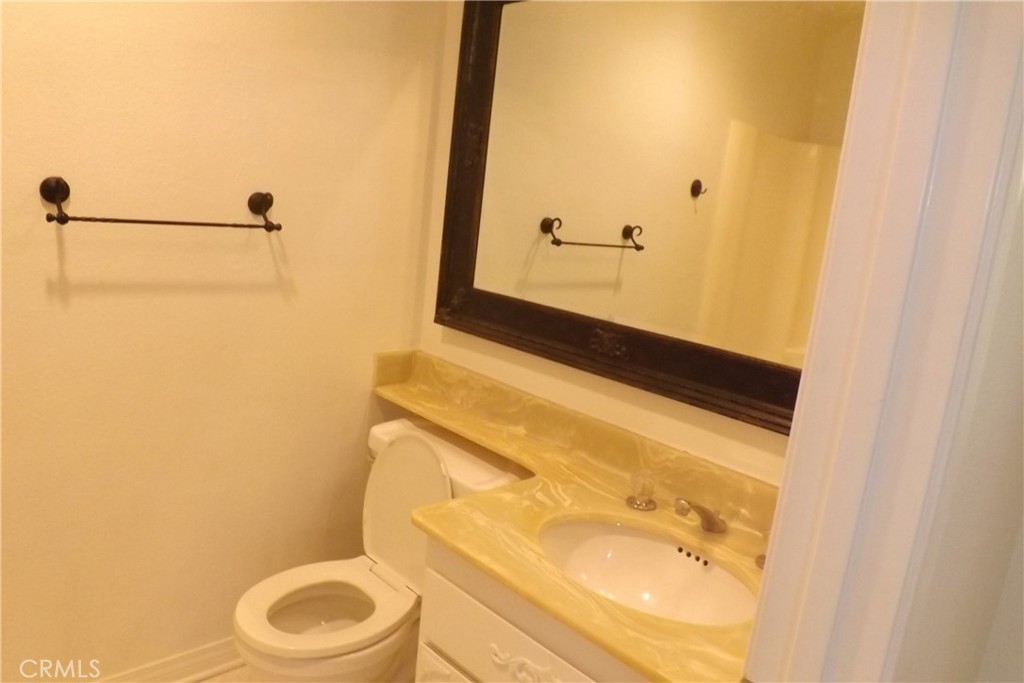 130 Avenida Adobe San Clemente, CA 92672 - Photo 16 of 26 a bathroom with a sink and a mirror