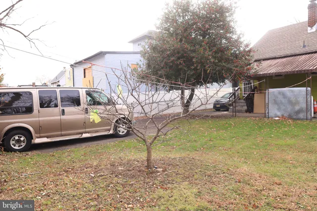 a white toilet sitting next to a shower