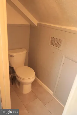 an empty room with closet area