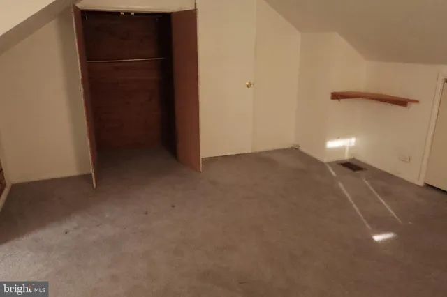 a bathroom with a sink a toilet a window and shower