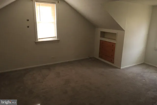 a shelf with cup and plates