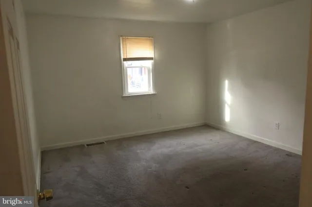 a view of a kitchen with a sink and cabinet window