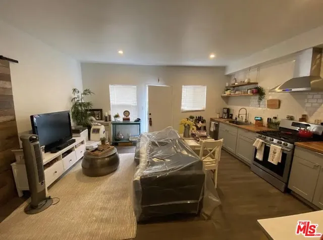 a view of a kitchen with workspace and a window