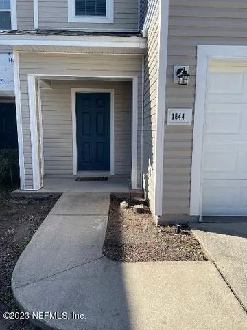 a view of a entryway door front of house