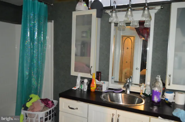 a bathroom with a sink and a mirror