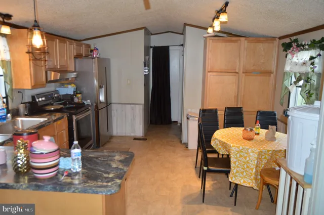 a kitchen with a sink and appliances