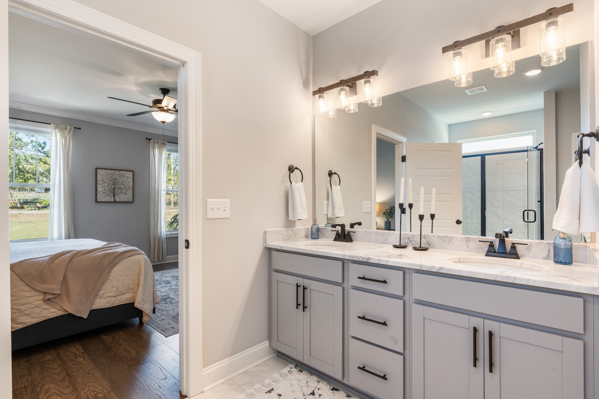 2070 Hamilton Chambers Road Lebanon, TN 37087 - Photo 19 of 43 a en suite bathroom with a double vanity sink and a mirror