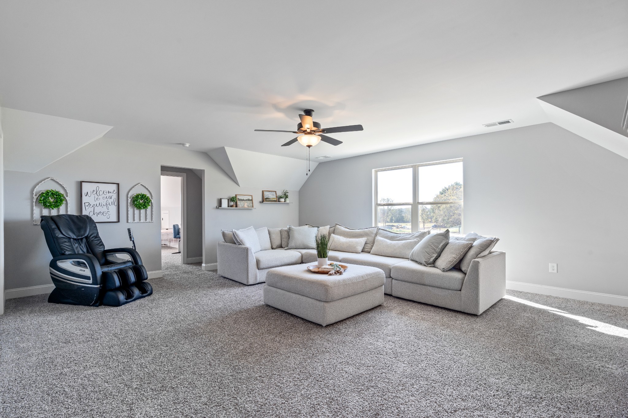 2070 Hamilton Chambers Road Lebanon, TN 37087 - Photo 24 of 43 a living room with furniture and a chandelier