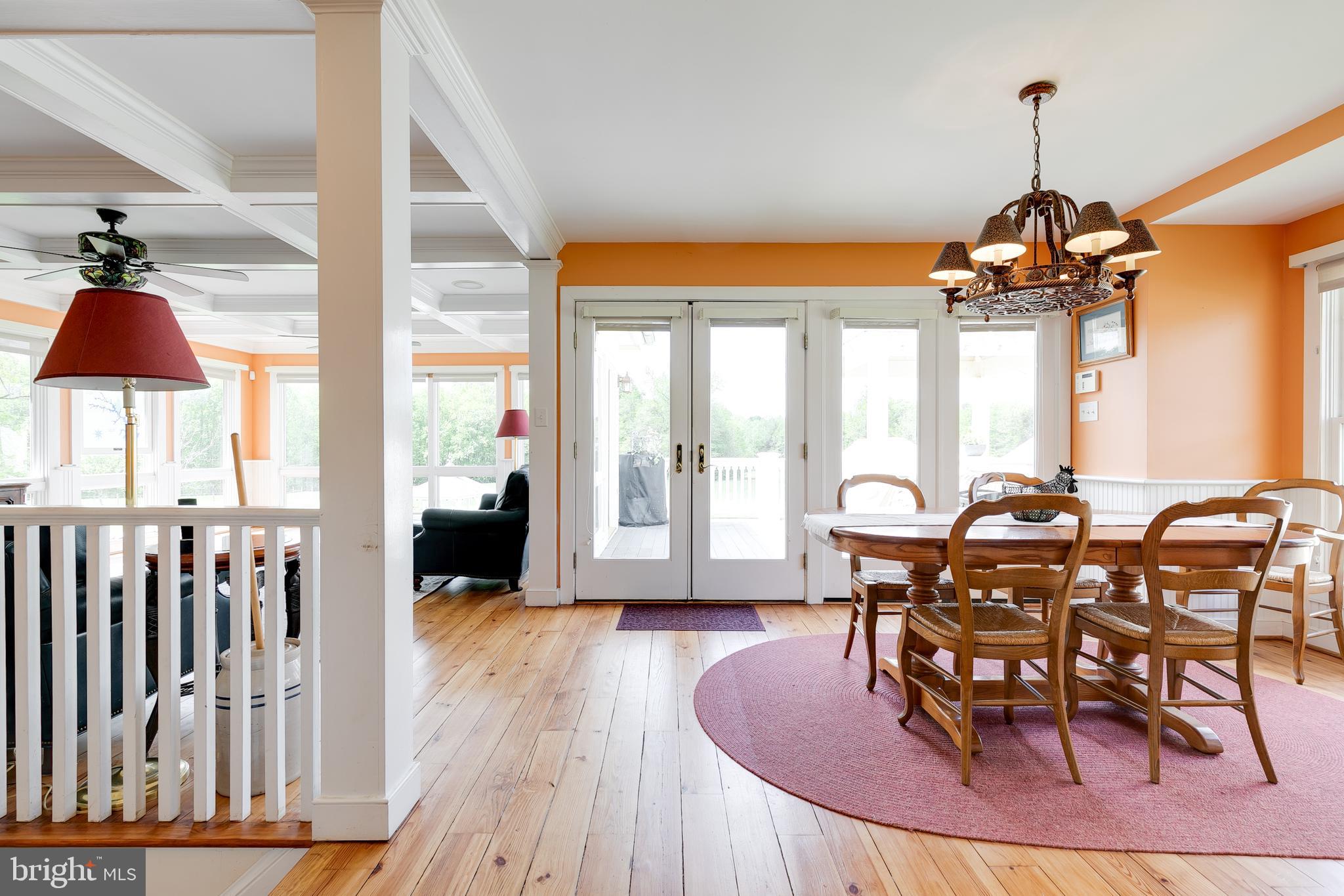2379 Pendleton Road Mineral, VA 23117 - Photo 15 of 55 a dining room with wooden floor glass table and chairs