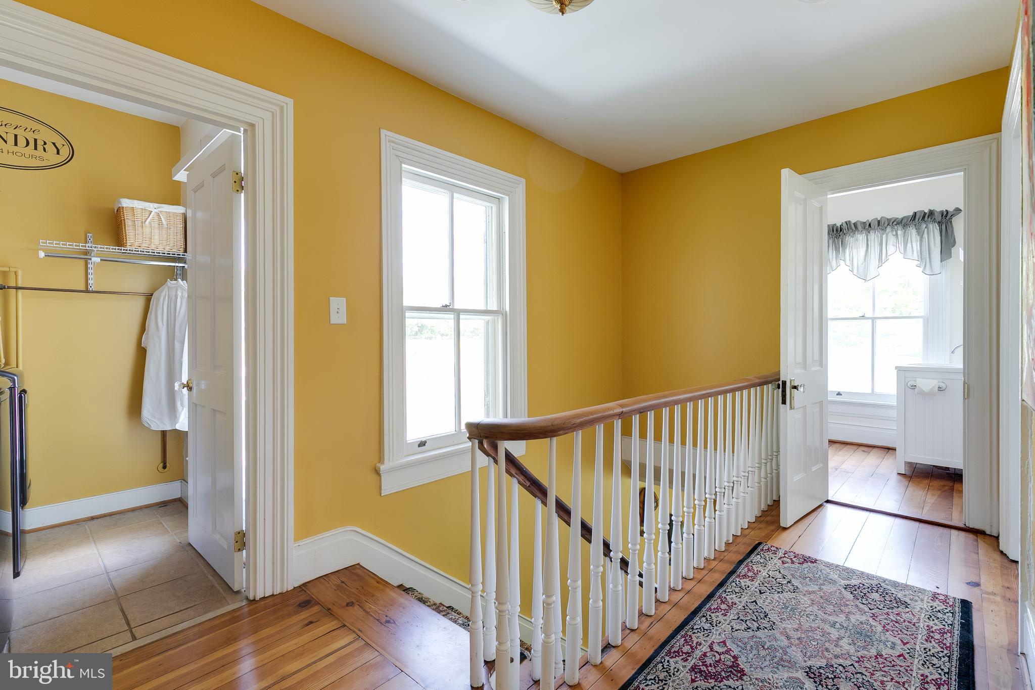 2379 Pendleton Road Mineral, VA 23117 - Photo 21 of 55 a view of a hallway with wooden floor and a bathroom