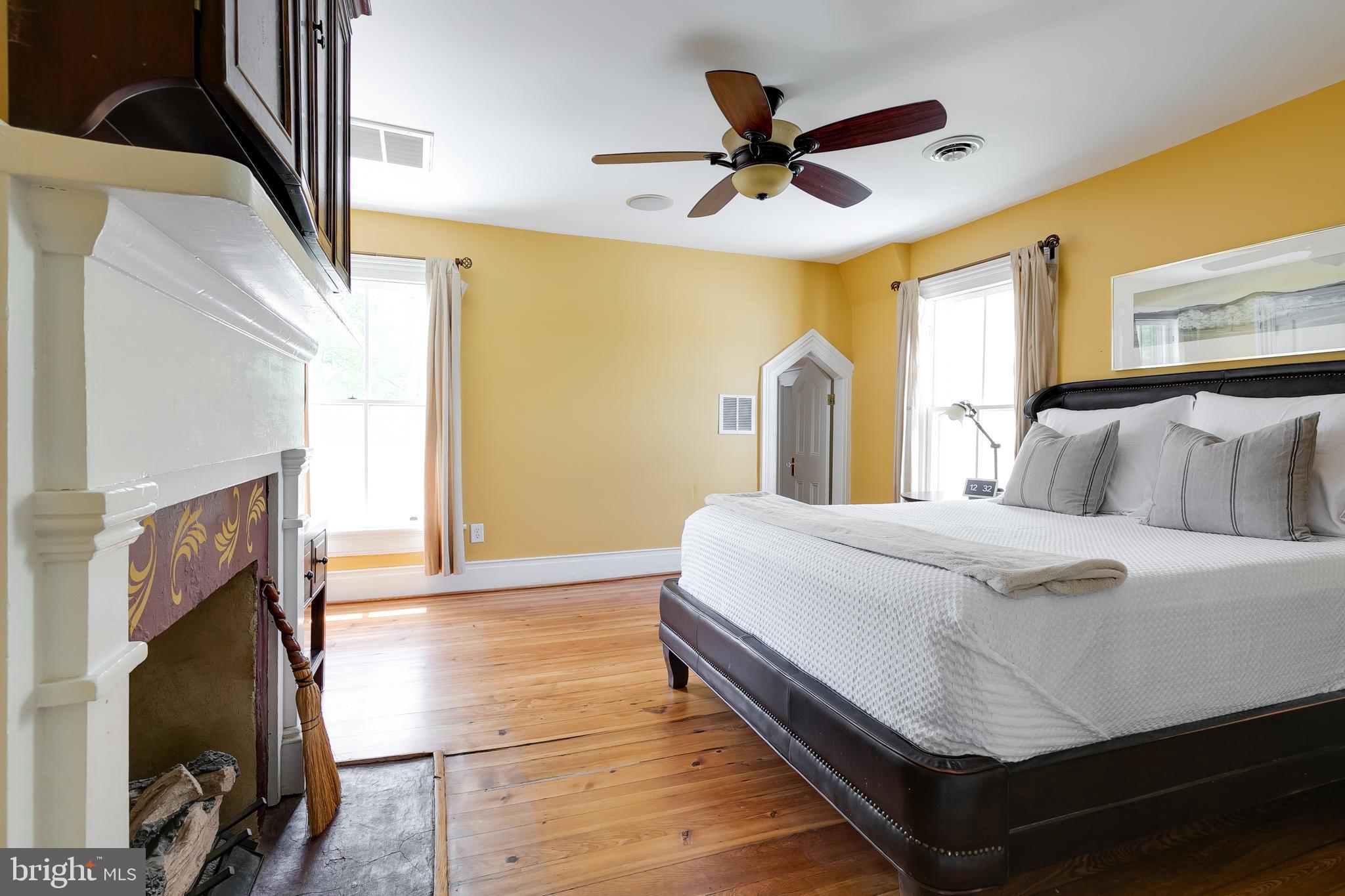 2379 Pendleton Road Mineral, VA 23117 - Photo 22 of 55 a bedroom with a large bed and a ceiling fan