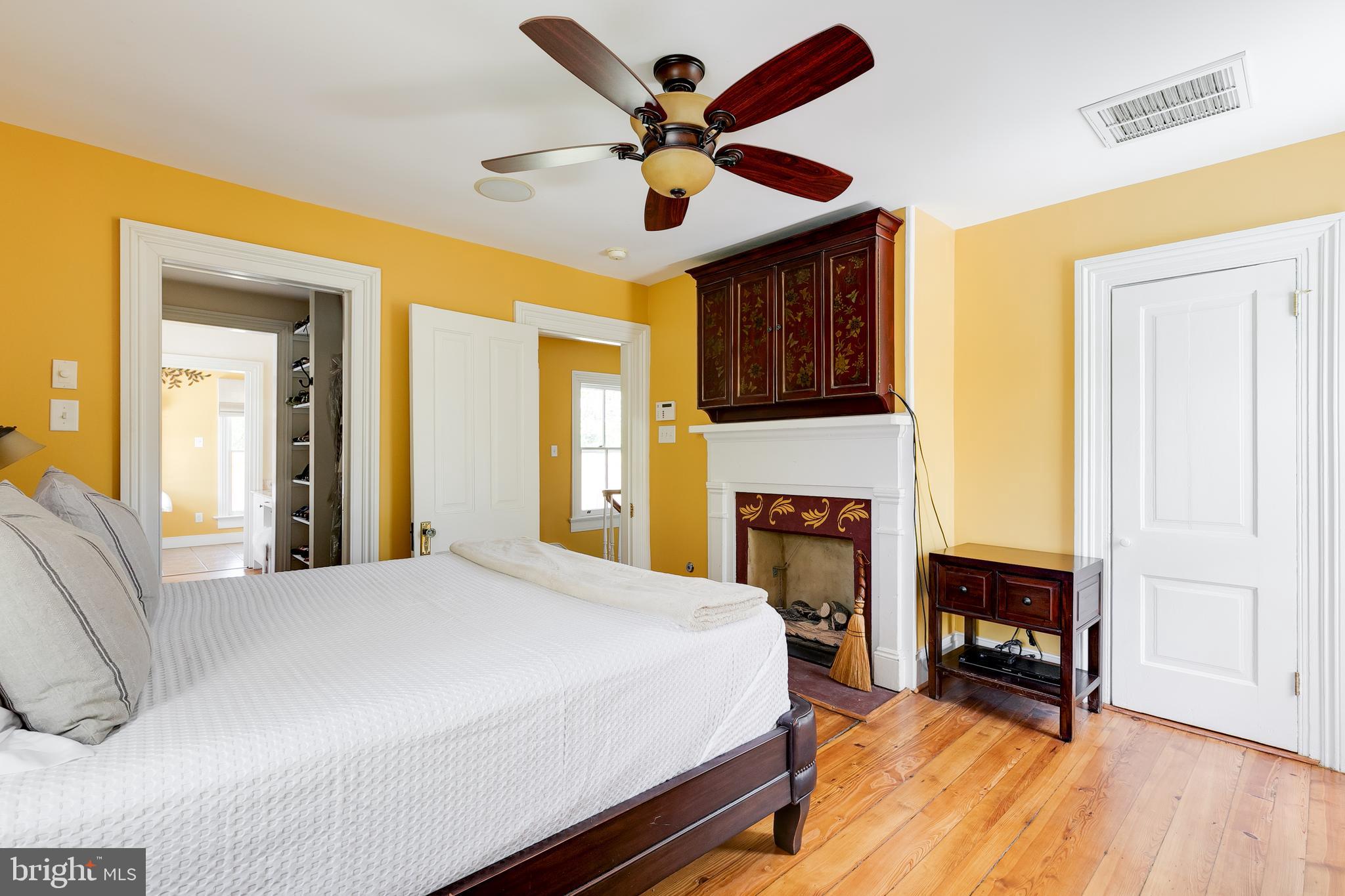 2379 Pendleton Road Mineral, VA 23117 - Photo 23 of 55 a spacious bedroom with a bed and a fireplace