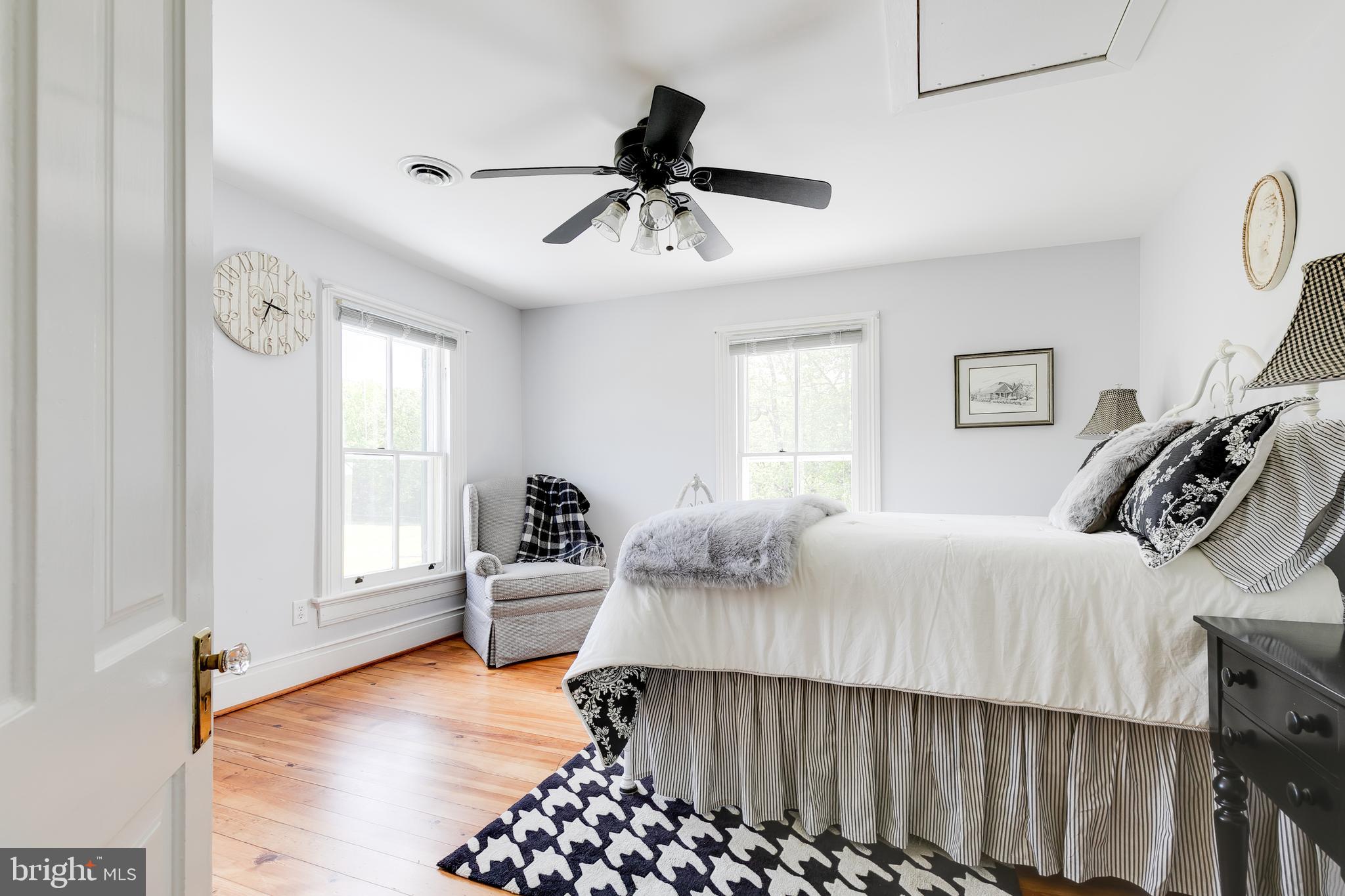 2379 Pendleton Road Mineral, VA 23117 - Photo 27 of 55 a bedroom with a bed and wooden floor