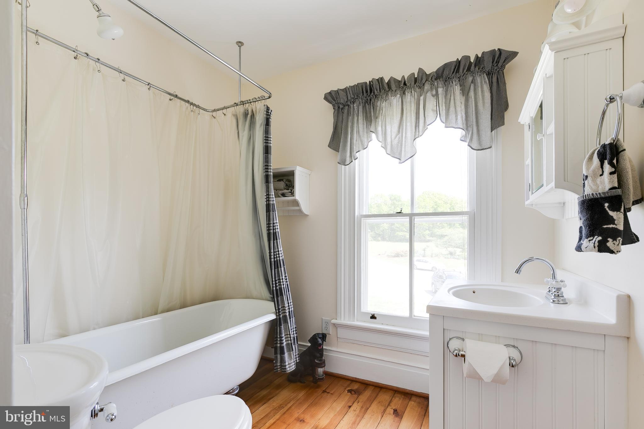 2379 Pendleton Road Mineral, VA 23117 - Photo 29 of 55 a bathroom with a sink a window and a bathtub