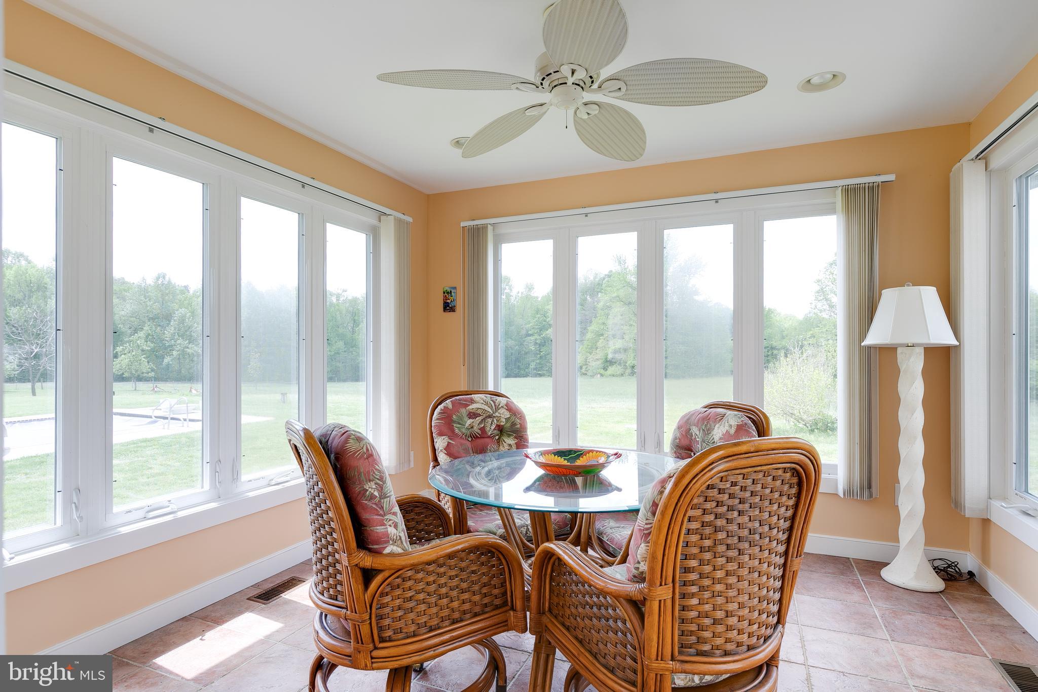 2379 Pendleton Road Mineral, VA 23117 - Photo 39 of 55 a dining room with furniture a chandelier and a large window