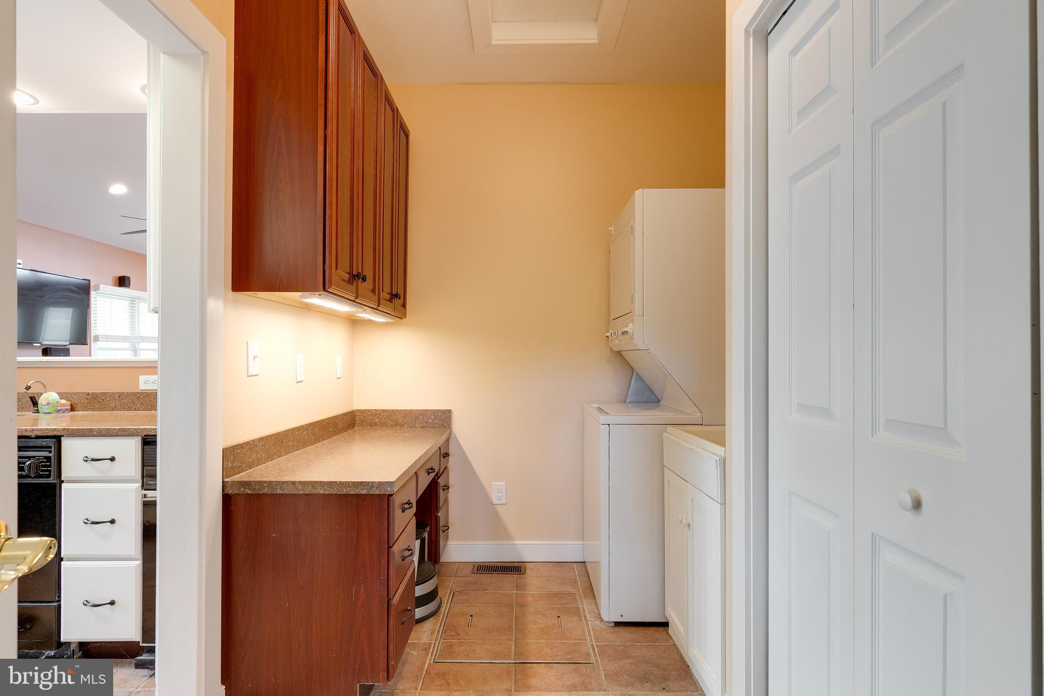 2379 Pendleton Road Mineral, VA 23117 - Photo 41 of 55 a utility room with cabinets washer and dryer