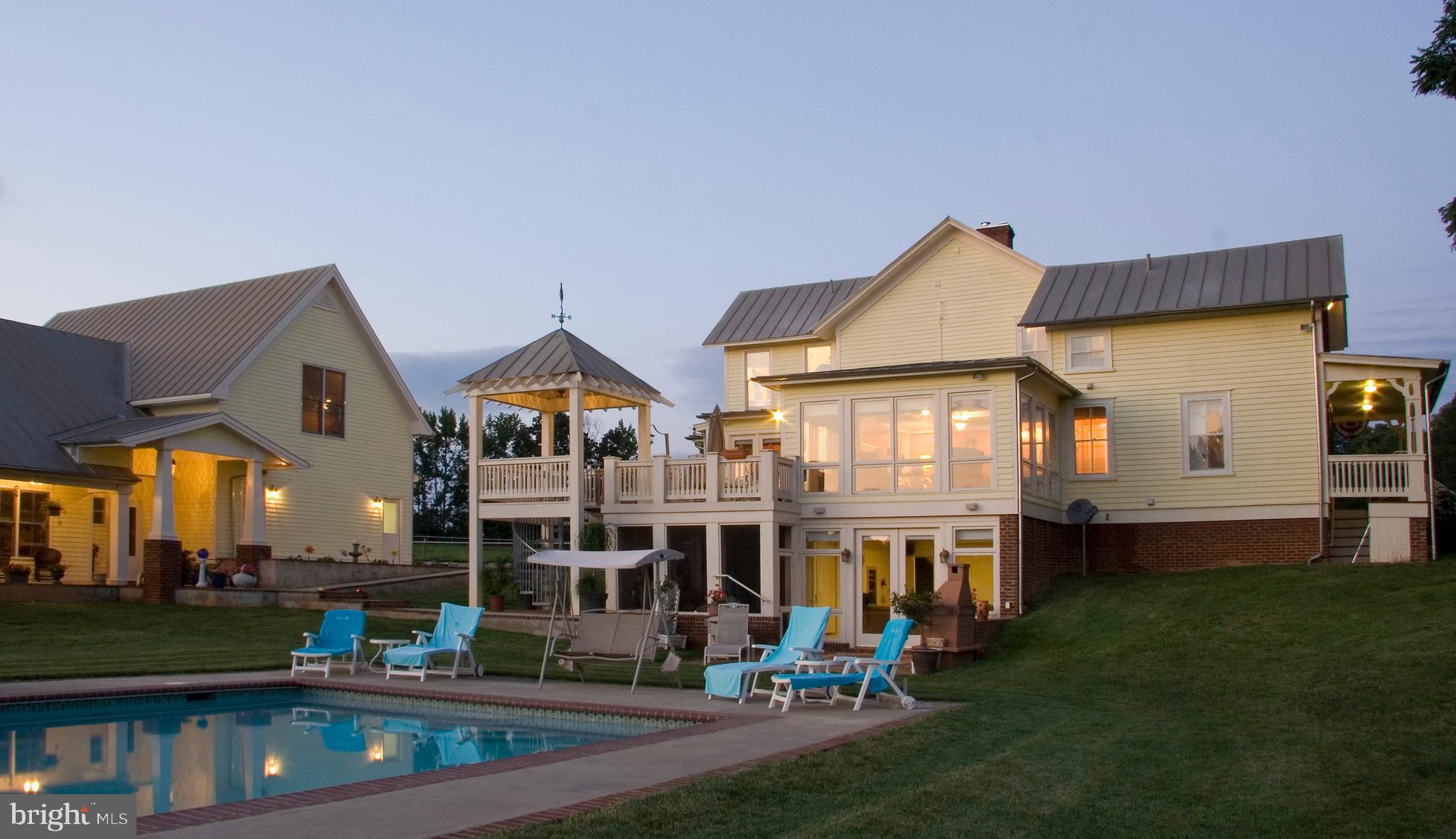 2379 Pendleton Road Mineral, VA 23117 - Photo 49 of 55 a front view of a house with a yard table and chairs