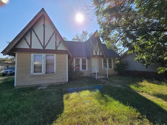front view of a house with a yard