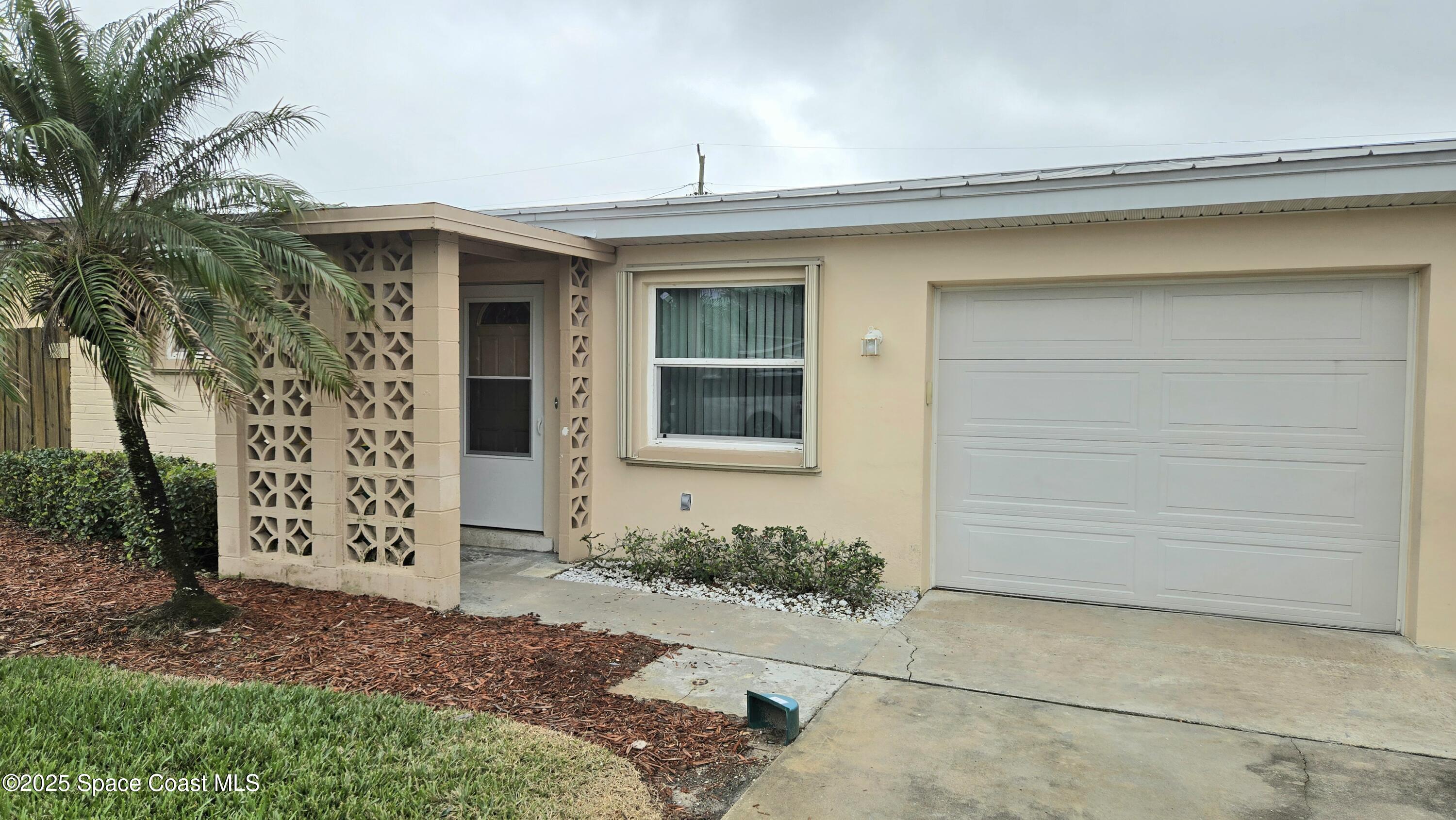 535 Lee Avenue, Unit A Satellite Beach, FL 32937 - Photo 1 of 12 front view of a house