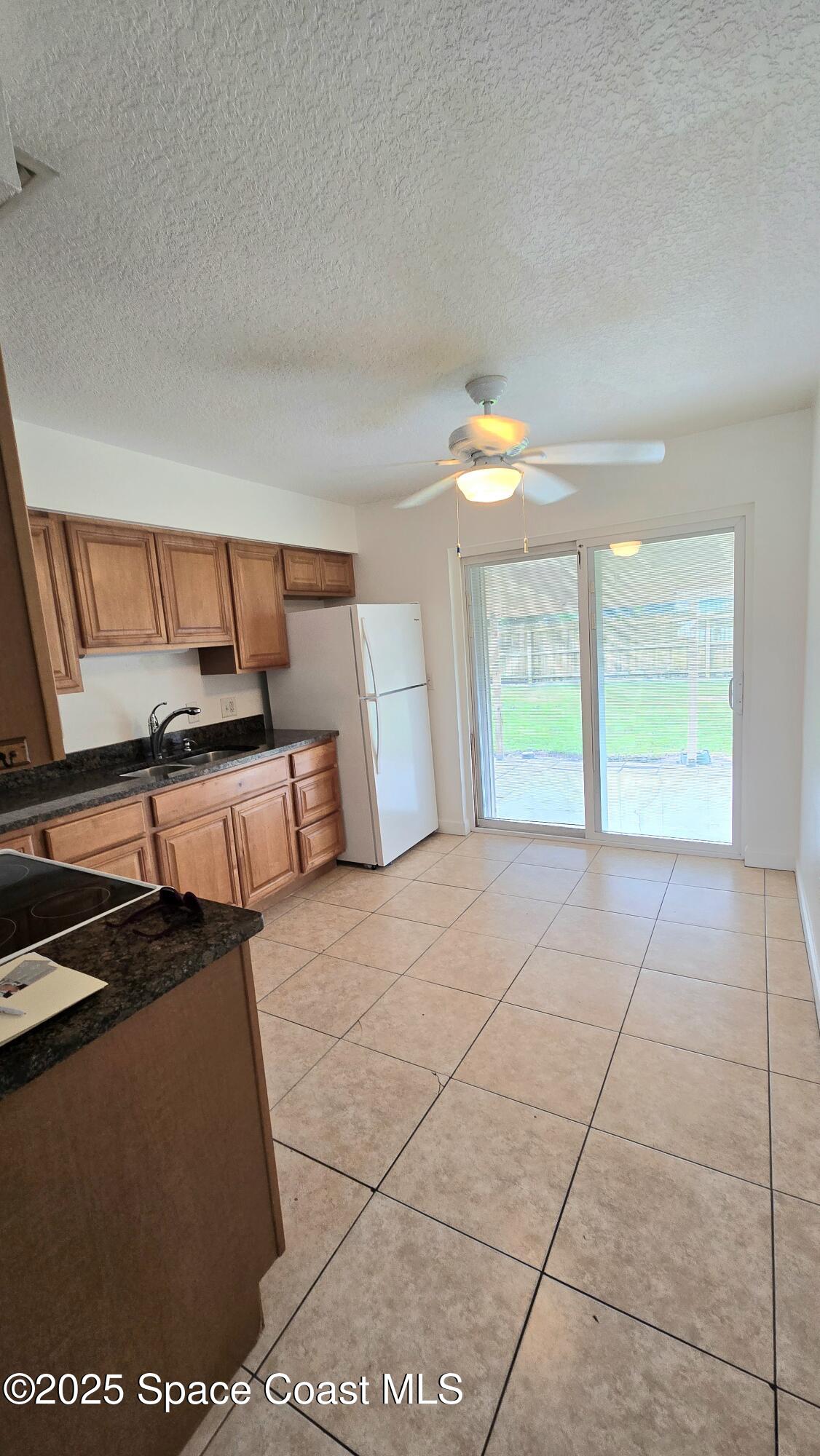 535 Lee Avenue, Unit A Satellite Beach, FL 32937 - Photo 3 of 12 a view of an empty room with a window