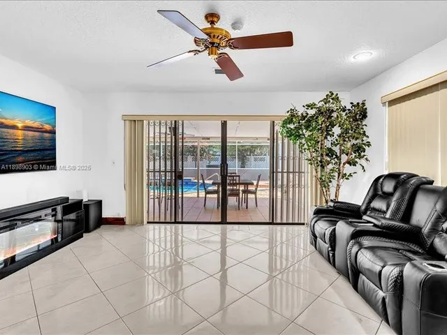a view of a living room and floor to ceiling window