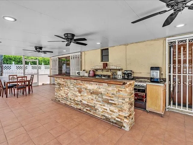 a very nice looking kitchen with a large window