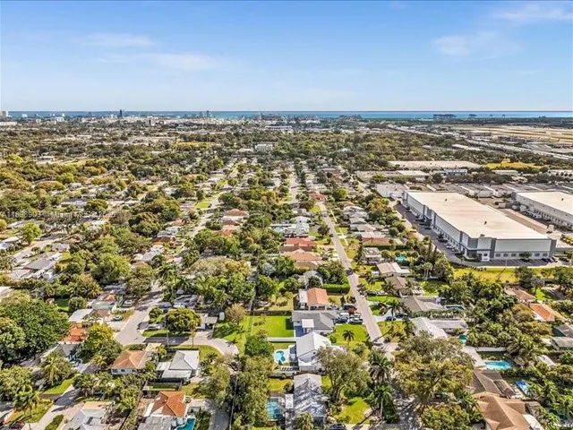 an aerial view of residential building and ocean