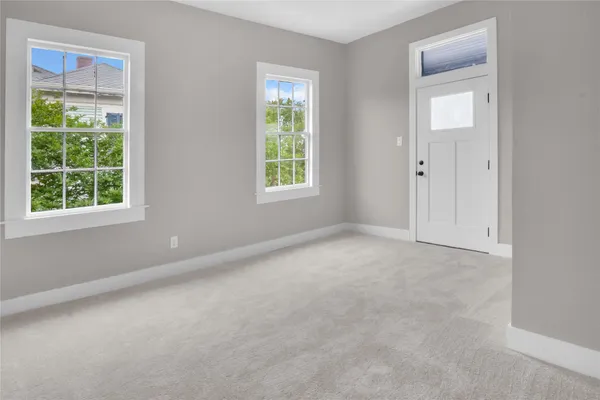 a view of a balcony with wooden floor