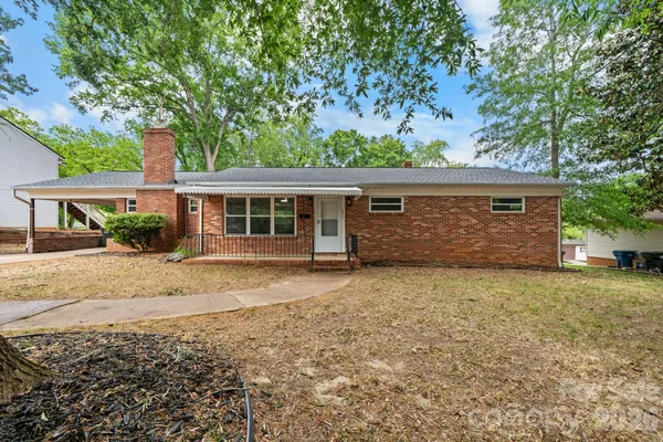front view of a house with a yard