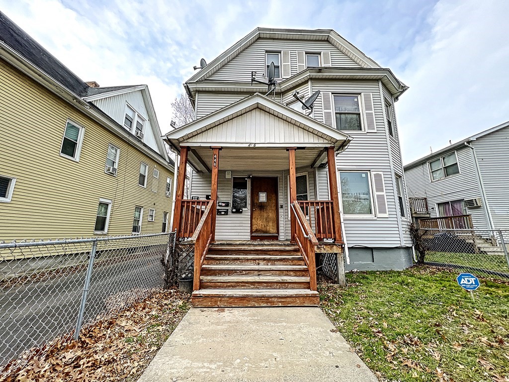 446 Liberty Street Springfield, MA 01104 - Photo 2 of 10 a front view of a house with a yard