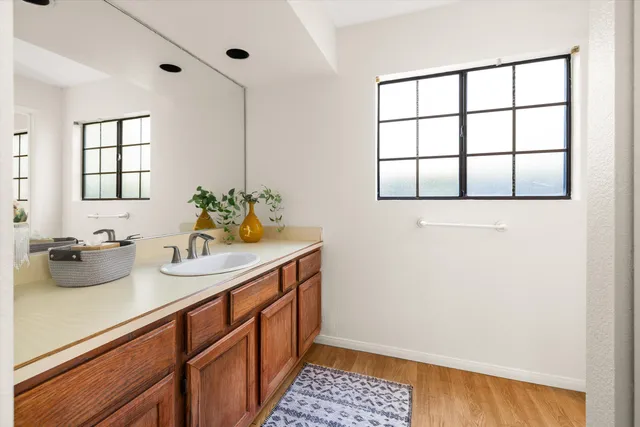 a bedroom with a bed and a chair