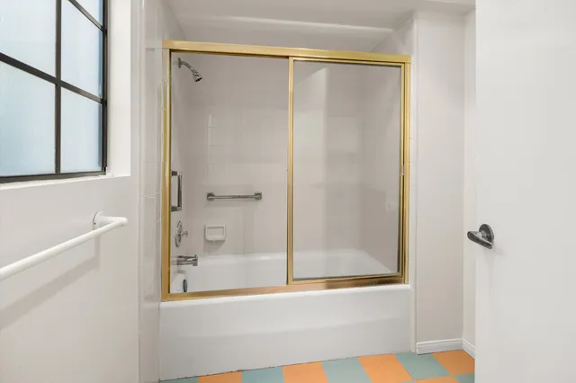 a kitchen with stainless steel appliances a sink and window