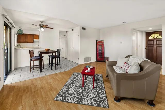 an aerial view of a house with a yard and potted plants