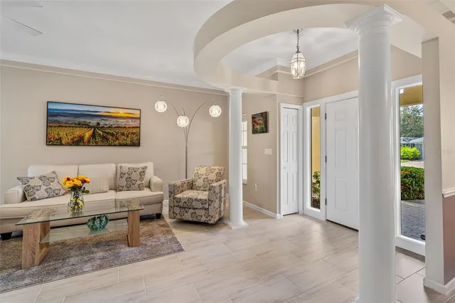 a living room with furniture and window