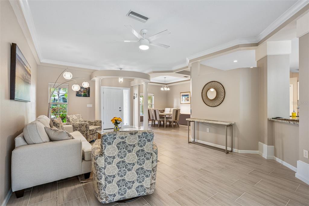 603 Pine Ranch East Road Osprey, FL 34229 - Photo 17 of 37 a living room with furniture and a wooden floor