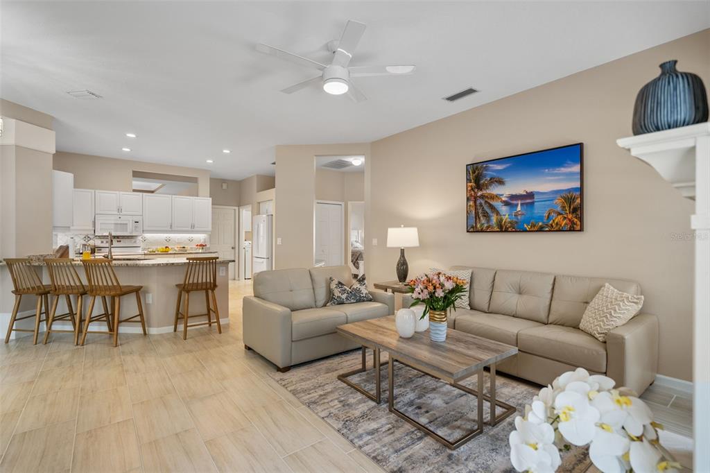 603 Pine Ranch East Road Osprey, FL 34229 - Photo 20 of 37 a living room with furniture and kitchen view