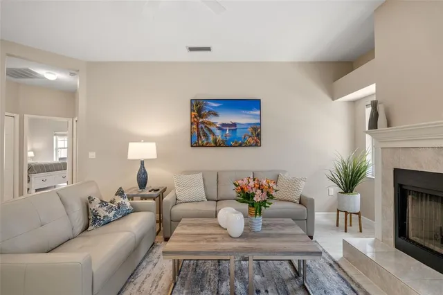 a living room with furniture and a fireplace