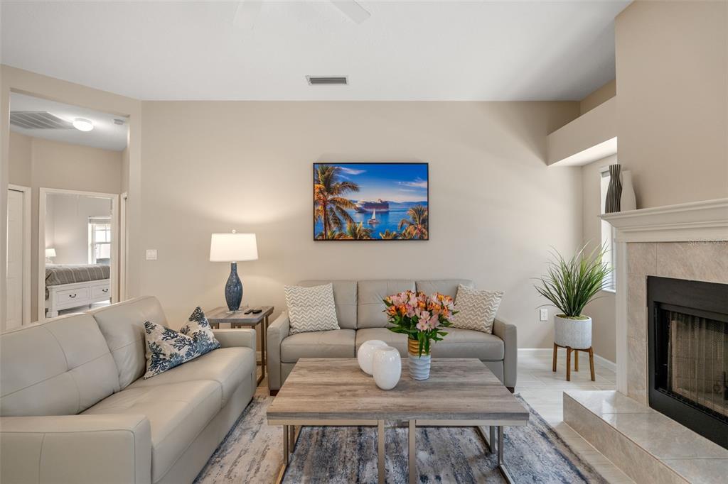 603 Pine Ranch East Road Osprey, FL 34229 - Photo 21 of 37 a living room with furniture and a fireplace