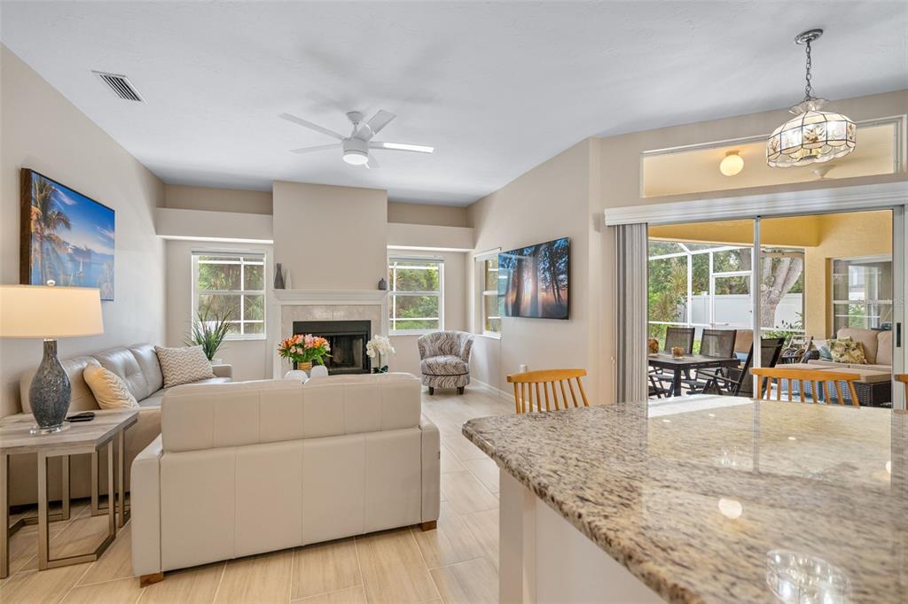 603 Pine Ranch East Road Osprey, FL 34229 - Photo 26 of 37 a living room with furniture and a fireplace