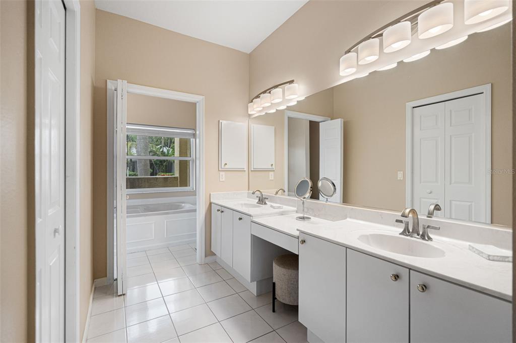 603 Pine Ranch East Road Osprey, FL 34229 - Photo 29 of 37 a bathroom with a sink double vanity and a mirror