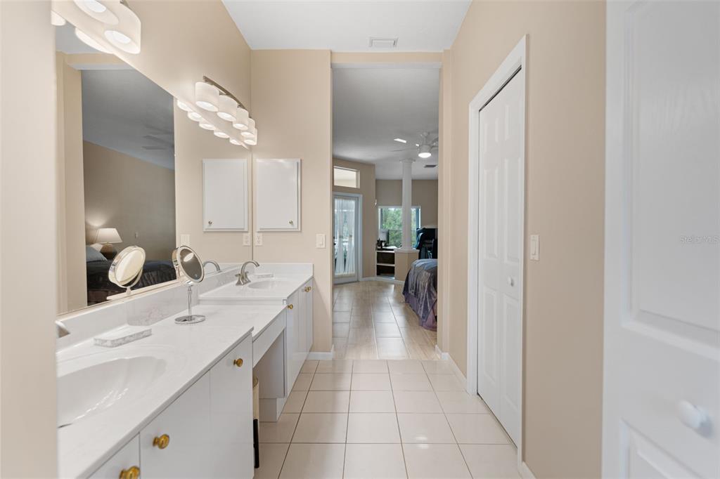 603 Pine Ranch East Road Osprey, FL 34229 - Photo 30 of 37 a en suite bathroom with a double vanity sink and a mirror