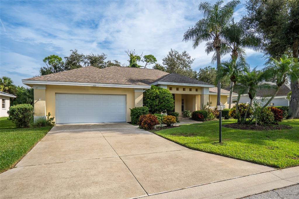 603 Pine Ranch East Road Osprey, FL 34229 - Photo 3 of 37 front view of a house with a yard