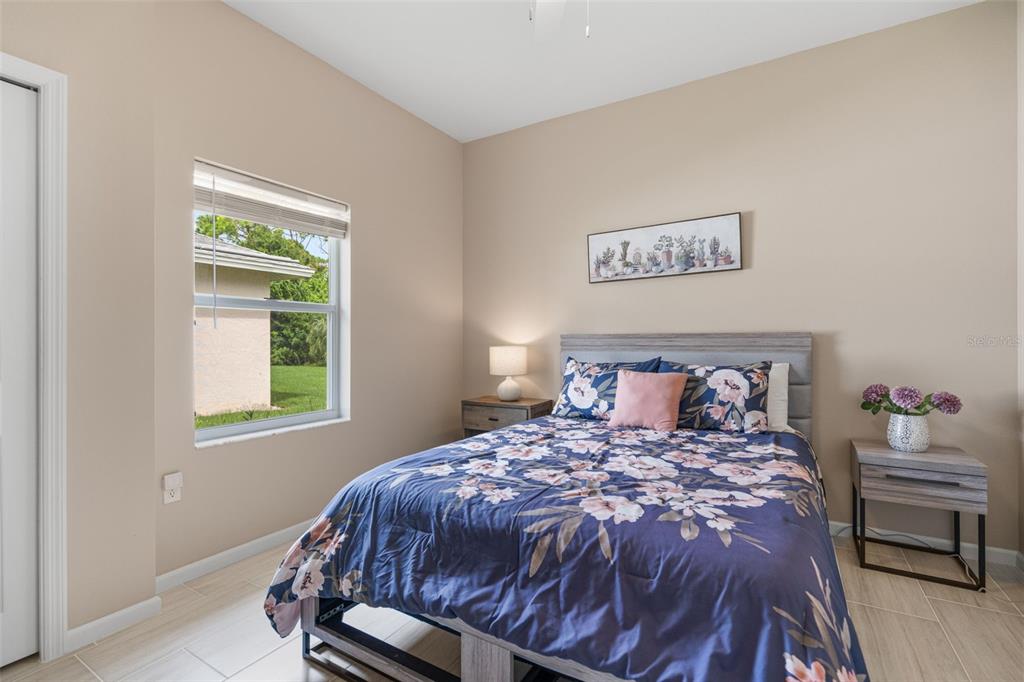 603 Pine Ranch East Road Osprey, FL 34229 - Photo 34 of 37 a bedroom with a bed and a window