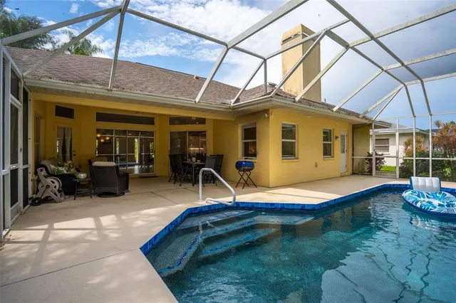 a backyard of a house with yard and outdoor seating