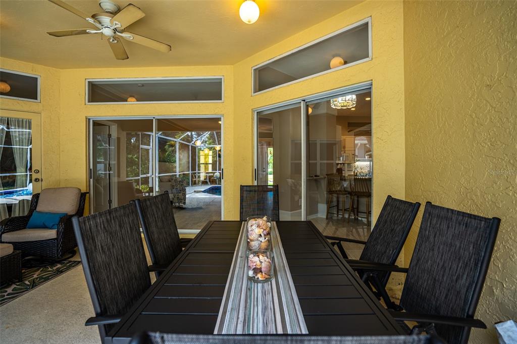 603 Pine Ranch East Road Osprey, FL 34229 - Photo 8 of 37 a view of a hallway with wooden floor and furniture