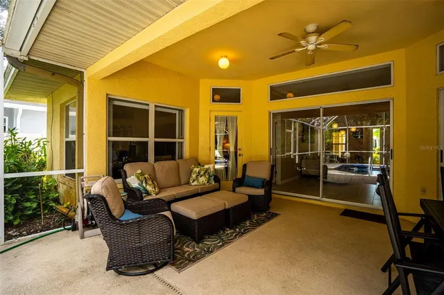 a outdoor living space with furniture and a potted plant