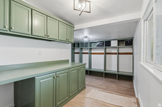 4270 River Road Oakley, UT 84055 - Photo 21 of 46 Mudroom featuring built-in cabinetry, extensive counter space, and integrated cubby storage