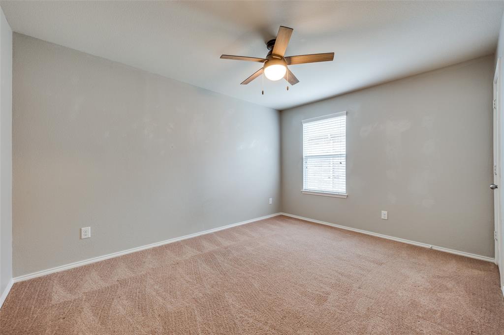 1420 Rivers Creek Lane Little Elm, TX 75068 - Photo 13 of 25 an empty room with a window and a fan
