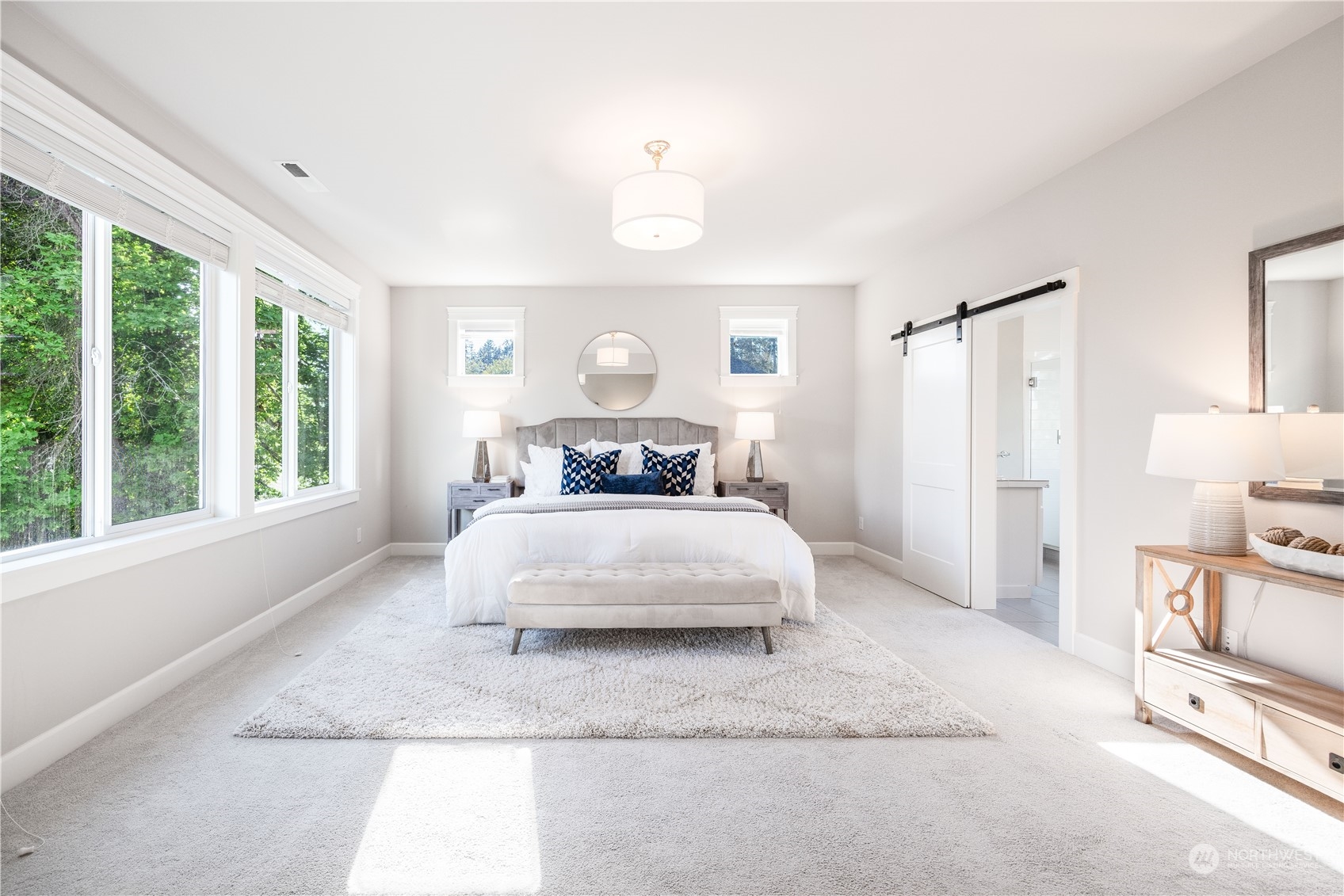 234 239th Street Southeast Bothell, WA 98021 - Photo 17 of 38 a bedroom with a large bed and a window