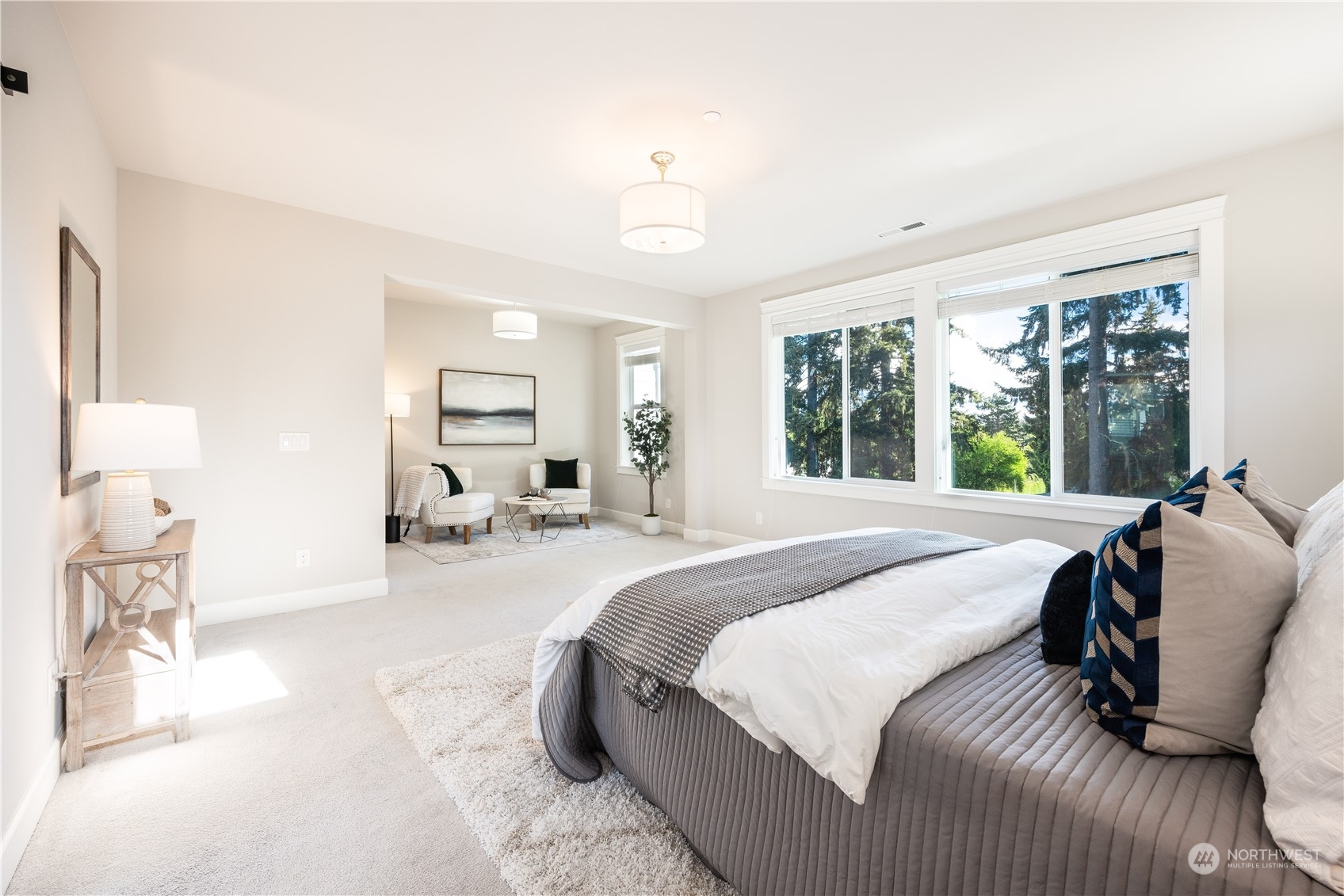 234 239th Street Southeast Bothell, WA 98021 - Photo 18 of 38 a bedroom with a large bed and a large window